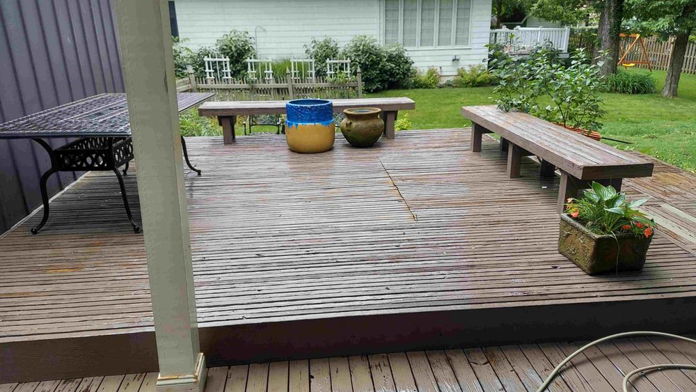 Weathered backyard wood deck before repair and refinishing